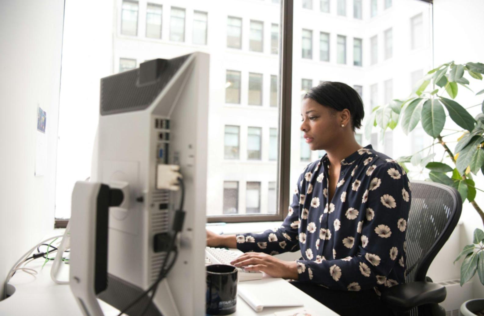 Financial technology development workspace with multiple screens showing code and data analytics